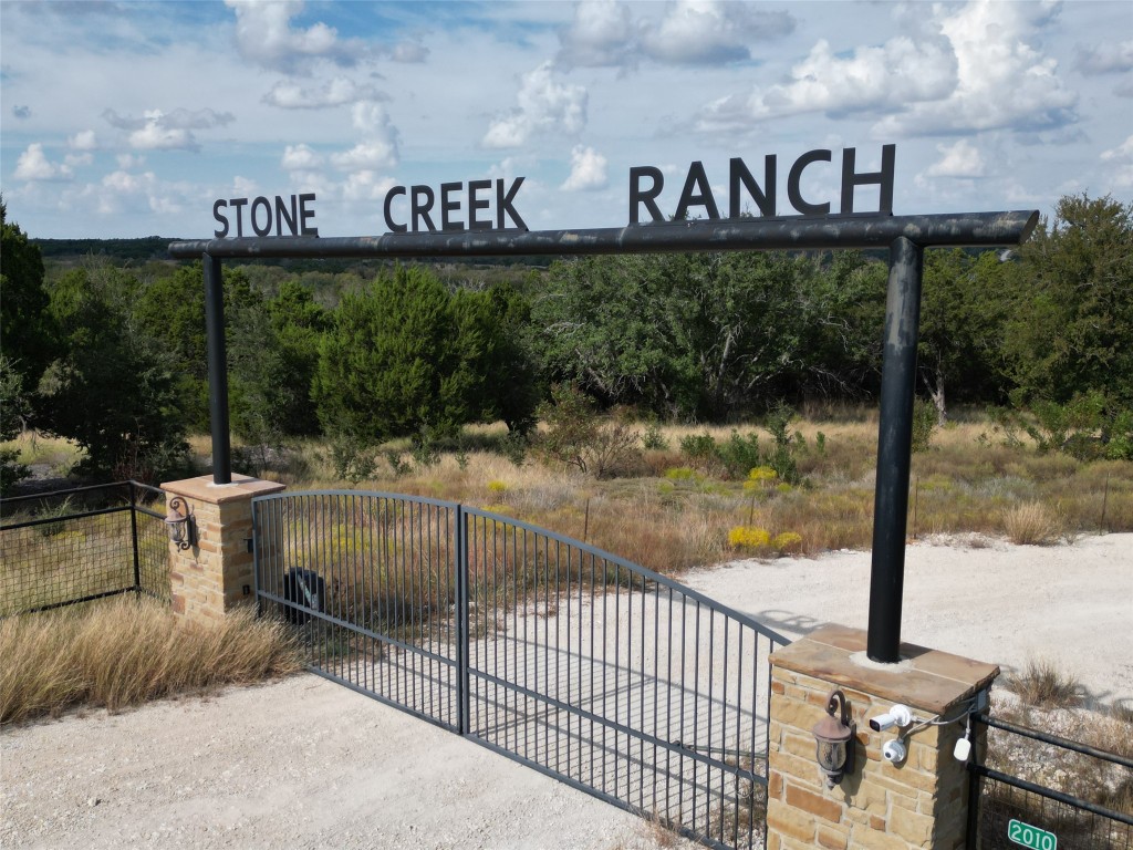 a view of a park with iron fence