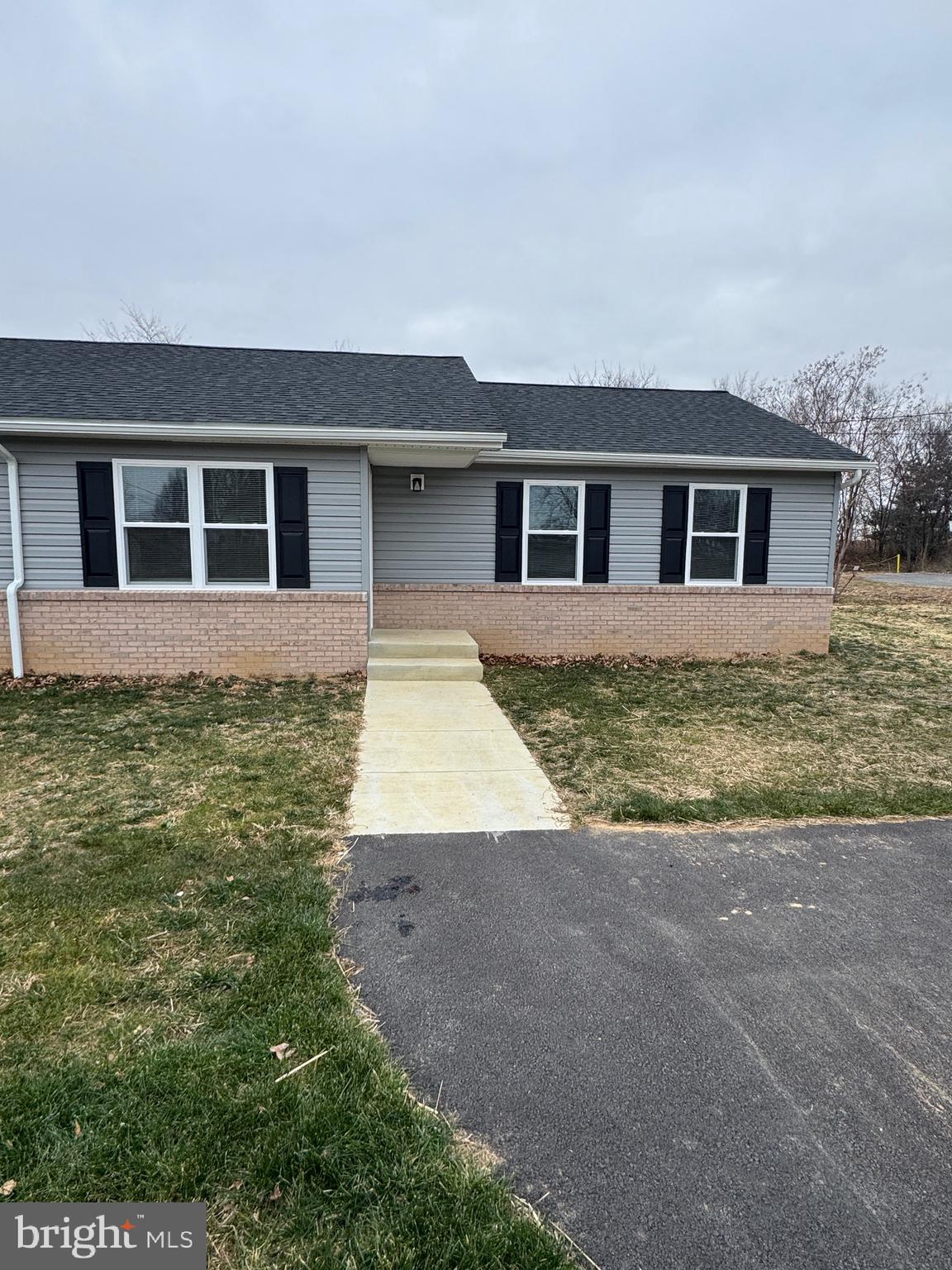 127 Longstreet Avenue Winchester, VA 22603 - Photo 1 of 18 a front view of house with yard and trees around