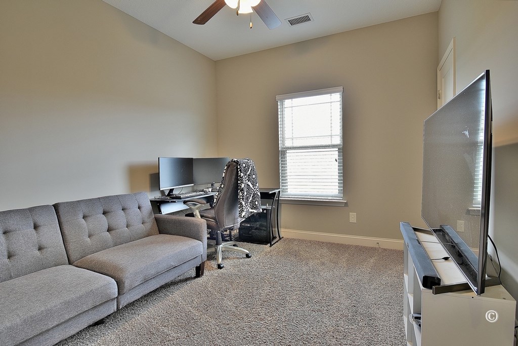 7 Eagle Ridge Lane Fort Mitchell, AL 36856 - Photo 21 of 24 a living room with furniture and a window
