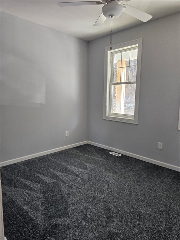 88 Stafford Holland Road Wales, MA 01081 - Photo 12 of 34 an empty room with a window