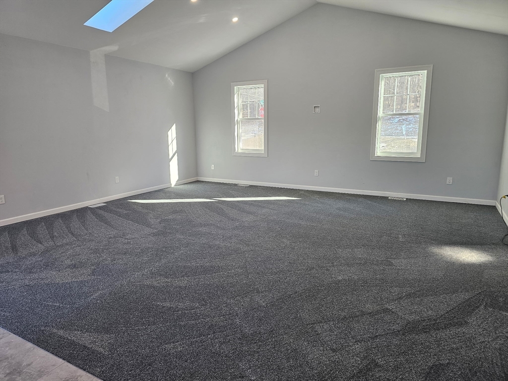 88 Stafford Holland Road Wales, MA 01081 - Photo 19 of 34 an empty room with windows and closet