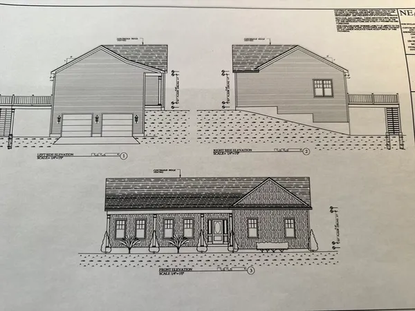 a front view of a house with large windows