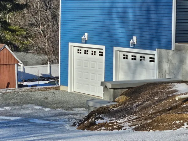a view of a brick house with a street