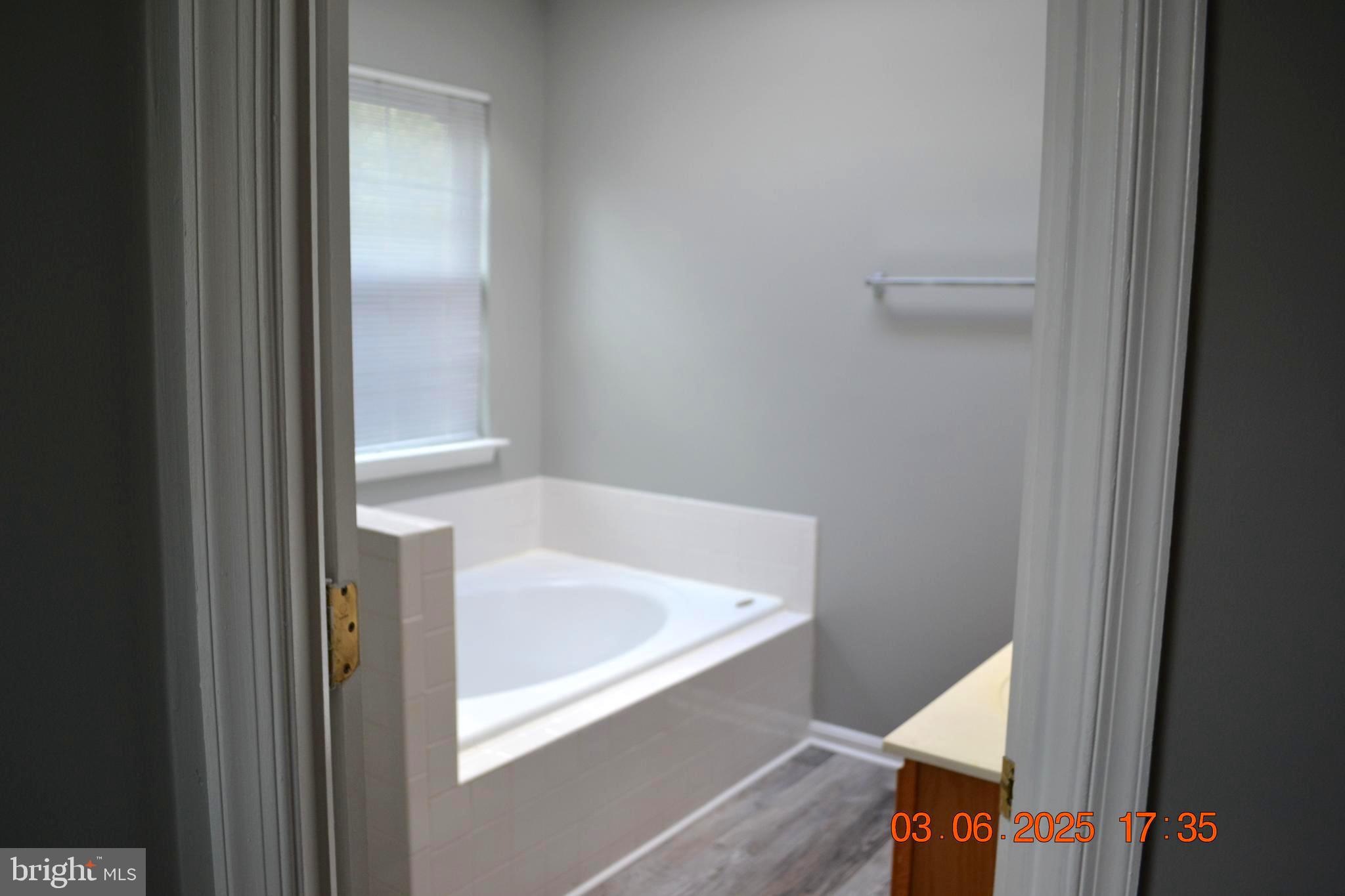 1302 Hill Born Drive Hanover, MD 21076 - Photo 15 of 31 a bathroom with a tub and sink