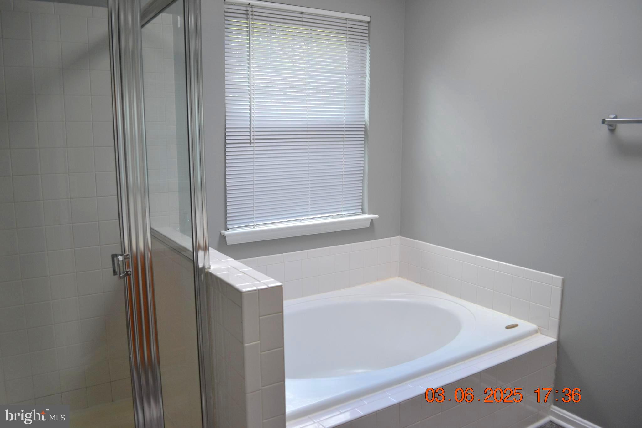 1302 Hill Born Drive Hanover, MD 21076 - Photo 17 of 31 a bath tub sitting next to a white sink