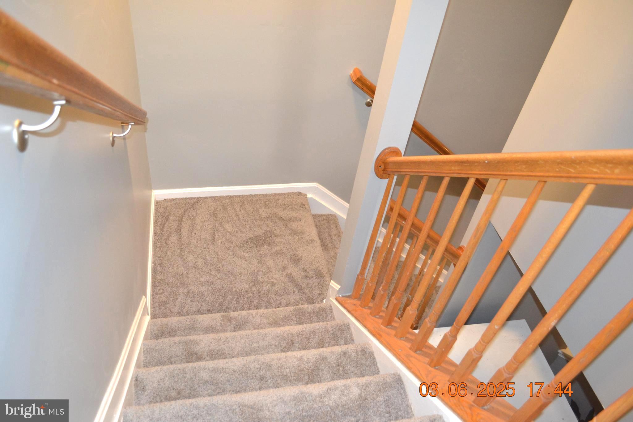 1302 Hill Born Drive Hanover, MD 21076 - Photo 21 of 31 a view of staircase with white walls and a window