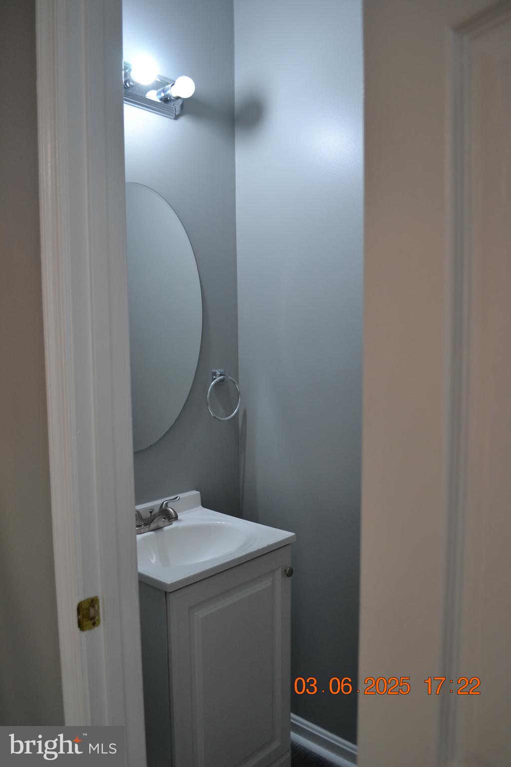 1302 Hill Born Drive Hanover, MD 21076 - Photo 31 of 31 a bathroom with a sink and a mirror