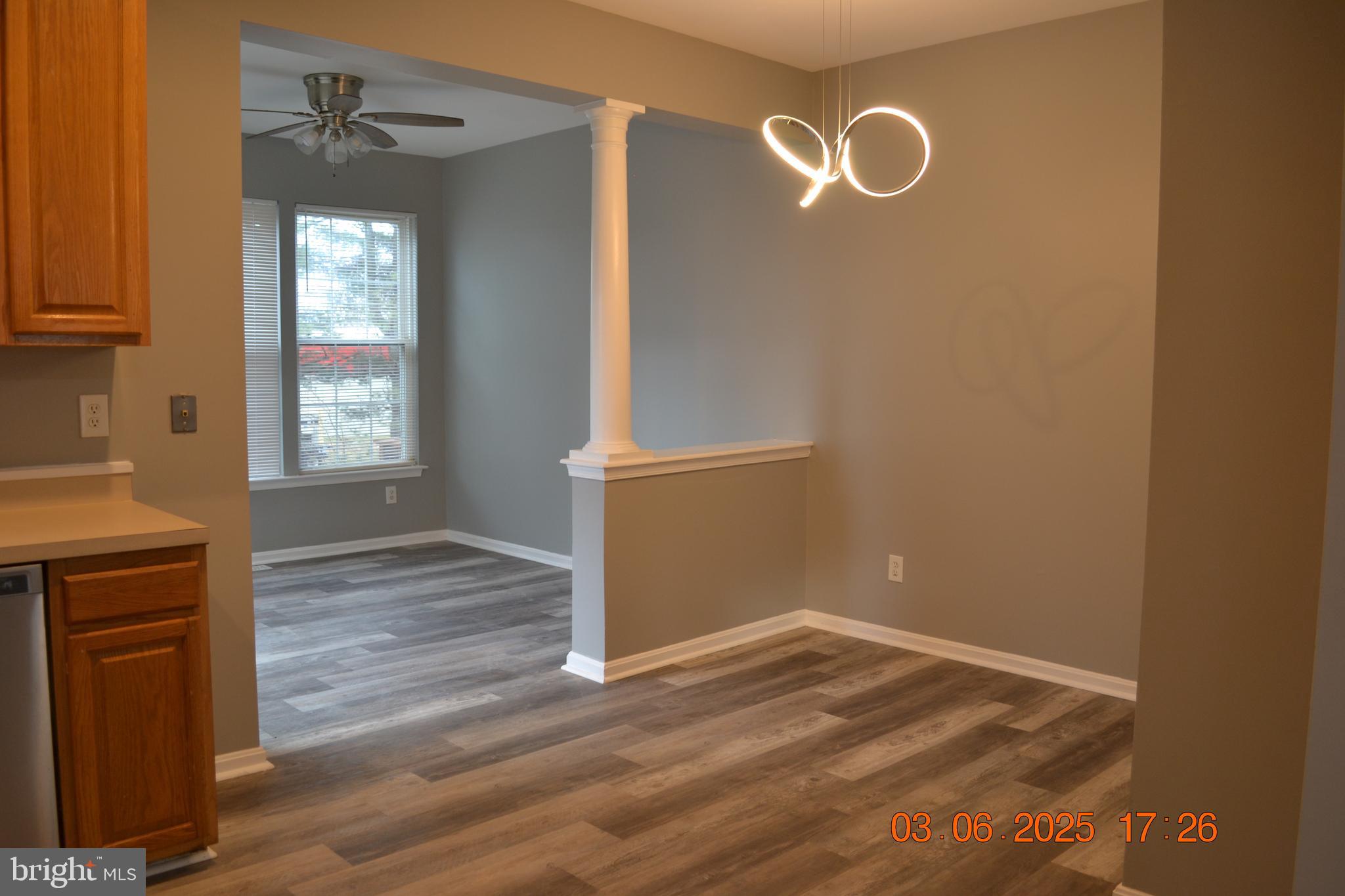 1302 Hill Born Drive Hanover, MD 21076 - Photo 8 of 31 a view of empty room with wooden floor and fan