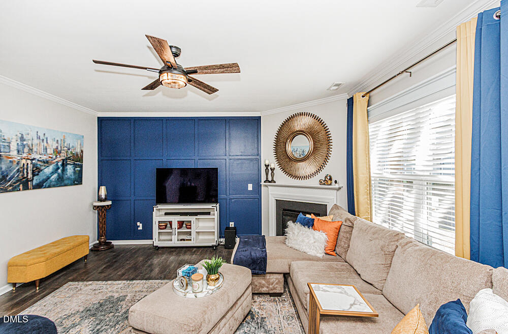 3425 Teravista Way Raleigh, NC 27616 - Photo 11 of 49 a living room with furniture a flat screen tv and a window