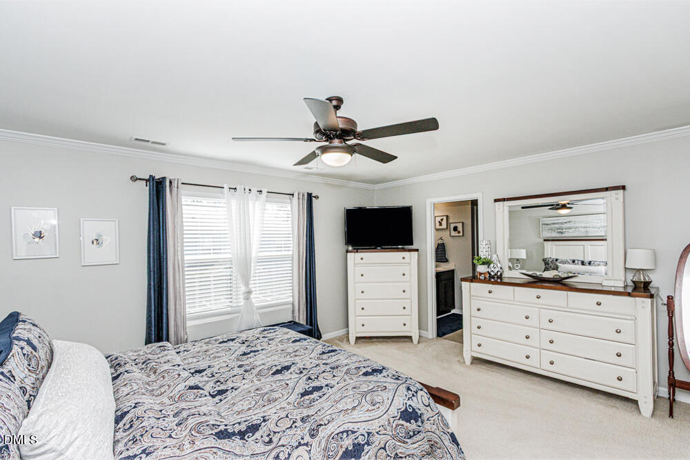 3425 Teravista Way Raleigh, NC 27616 - Photo 27 of 49 a bed room with a bed and a television