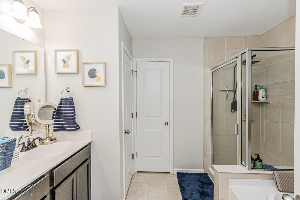 3425 Teravista Way Raleigh, NC 27616 - Photo 30 of 49 a bathroom with a sink a toilet and shower