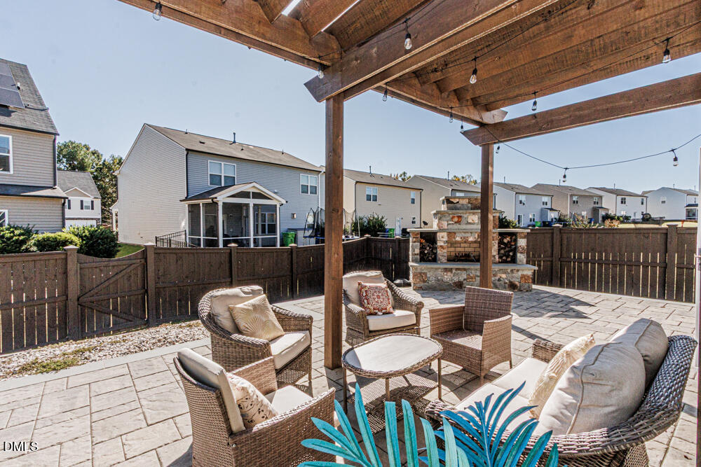3425 Teravista Way Raleigh, NC 27616 - Photo 36 of 49 a view of a patio with couches table and chairs and potted plants