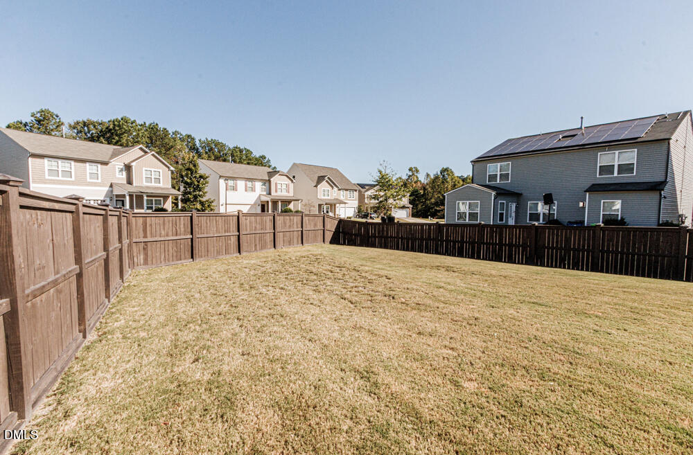 3425 Teravista Way Raleigh, NC 27616 - Photo 39 of 49 a view of a house with a wooden fence