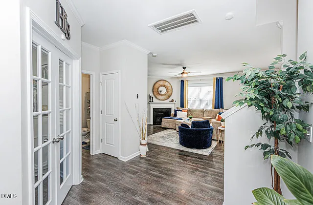 a living room with furniture and a clock