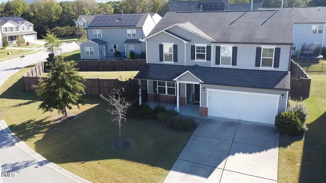 an aerial view of a house with swimming pool
