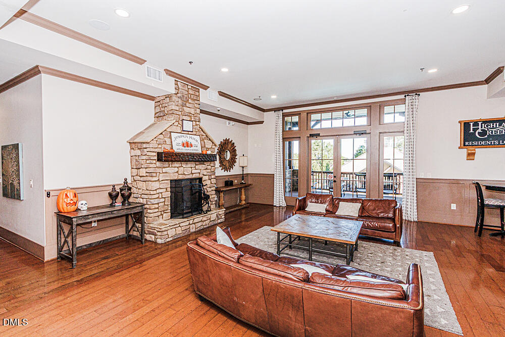 3425 Teravista Way Raleigh, NC 27616 - Photo 45 of 49 a living room with furniture a fireplace and a large window