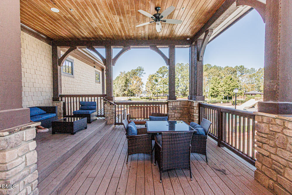 3425 Teravista Way Raleigh, NC 27616 - Photo 47 of 49 a balcony with wooden floor table and chairs