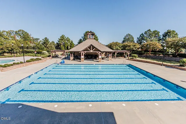 a view of a swimming pool with an outdoor seating