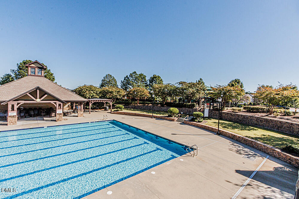 3425 Teravista Way Raleigh, NC 27616 - Photo 49 of 49 a view of a swimming pool with an outdoor seating
