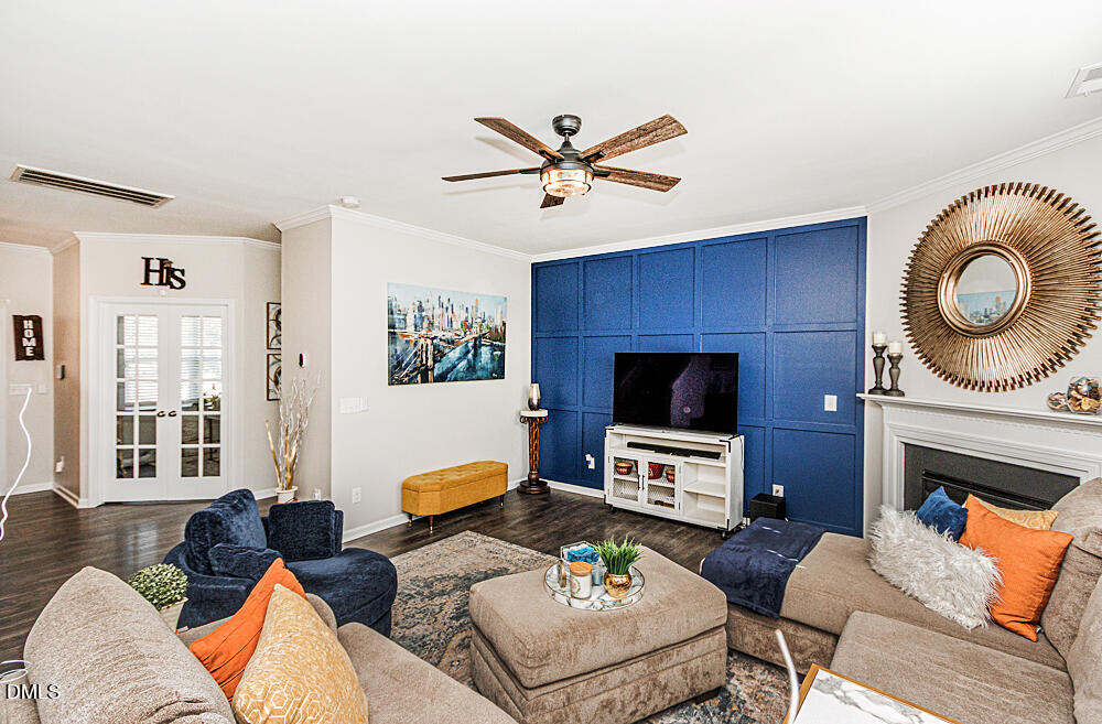 3425 Teravista Way Raleigh, NC 27616 - Photo 10 of 49 a living room with furniture a fireplace and a flat screen tv