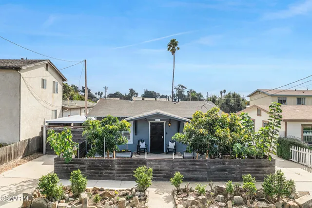 a view of a house with a garden