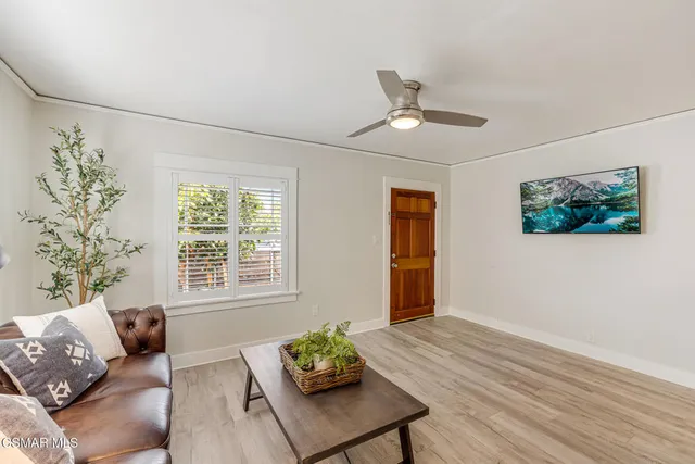 a living room with furniture and window