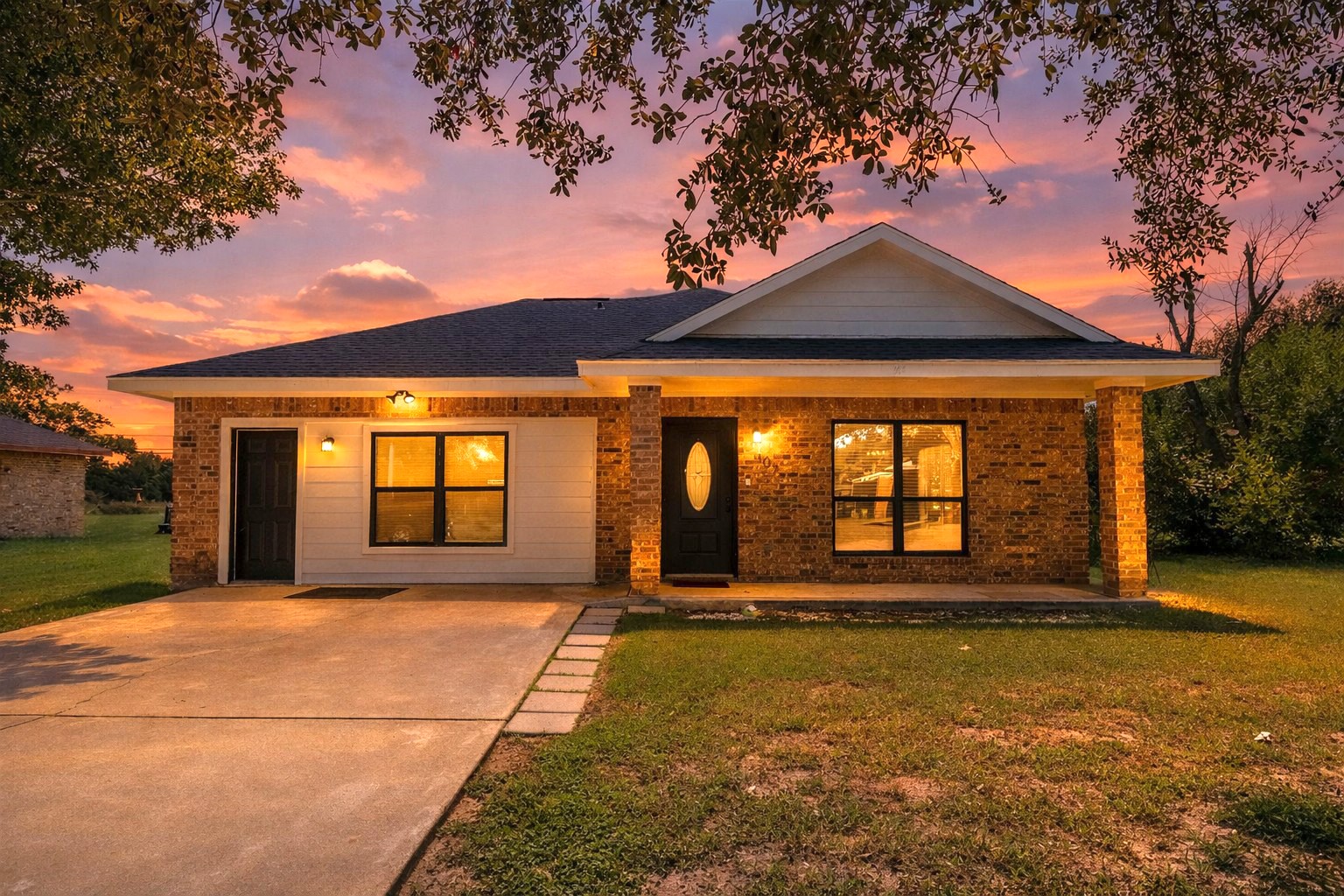 a front view of a house with a yard