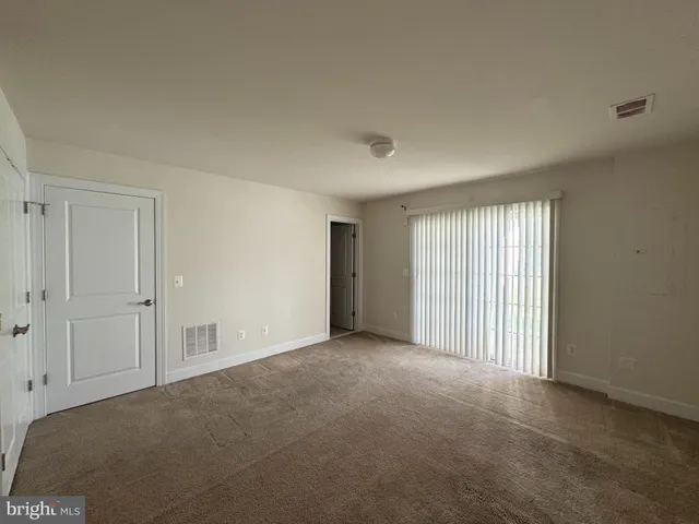 a view of empty room with windows