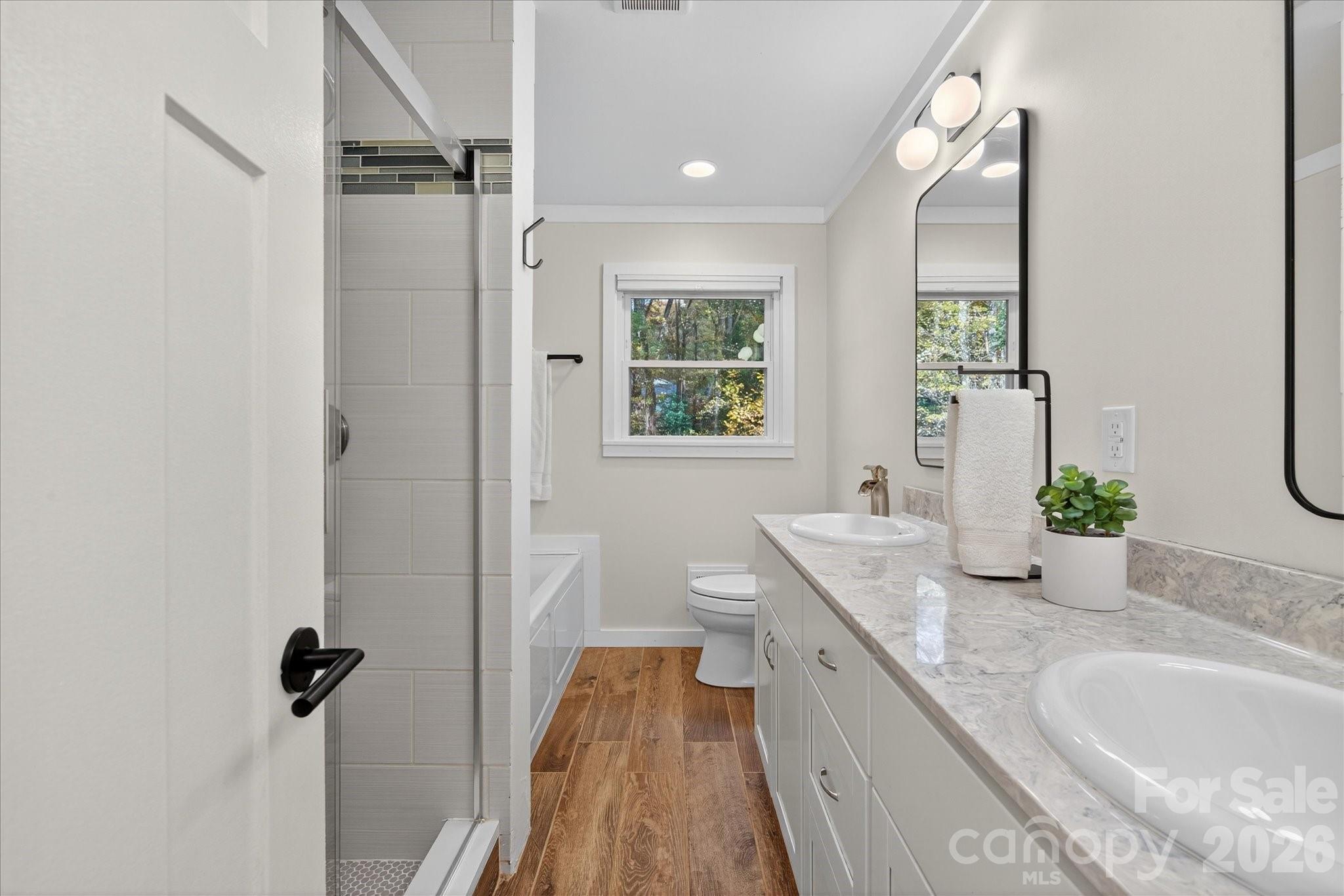 6431 Rosecrest Drive Charlotte, NC 28210 - Photo 12 of 46 a bathroom with a granite countertop sink mirror and a bathtub