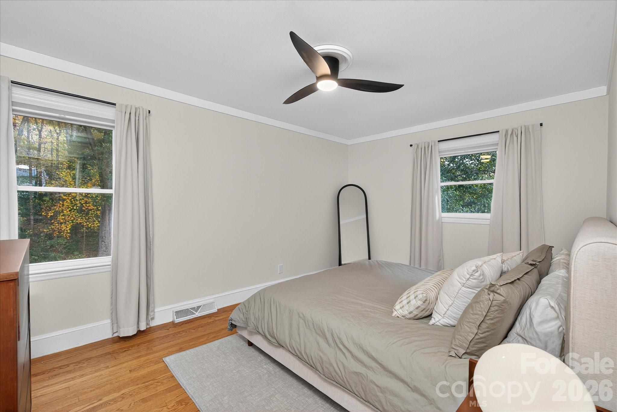 6431 Rosecrest Drive Charlotte, NC 28210 - Photo 14 of 46 a bedroom with a large bed and a window