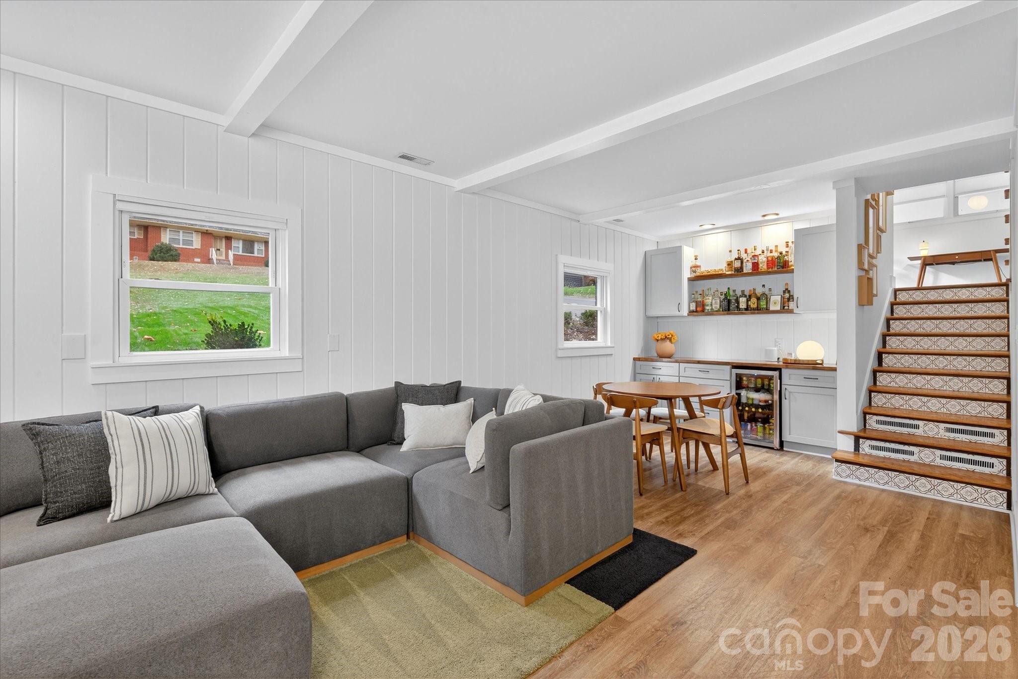 6431 Rosecrest Drive Charlotte, NC 28210 - Photo 23 of 46 a living room with furniture and a dining table with kitchen view