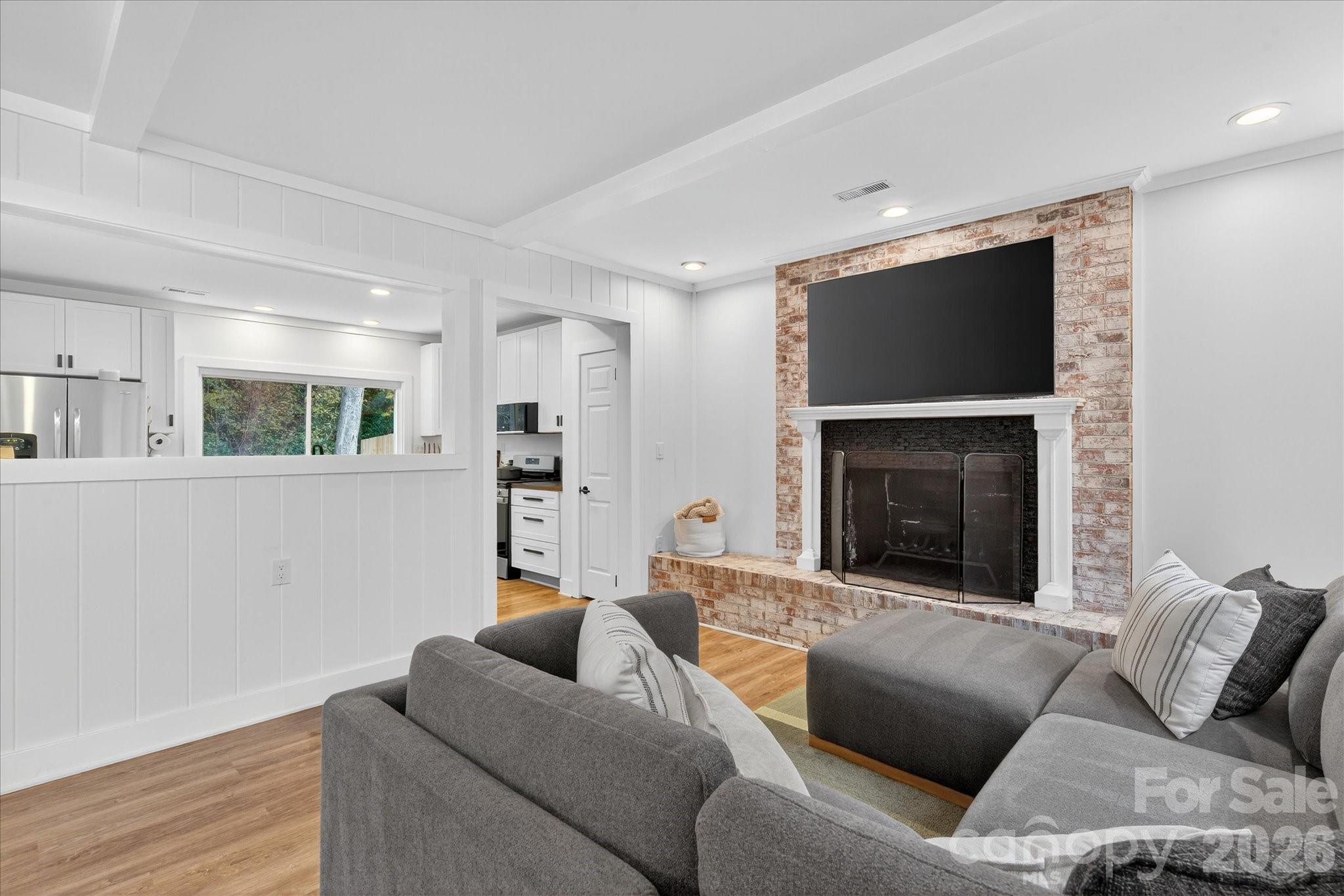 6431 Rosecrest Drive Charlotte, NC 28210 - Photo 27 of 46 a living room with furniture and a fireplace