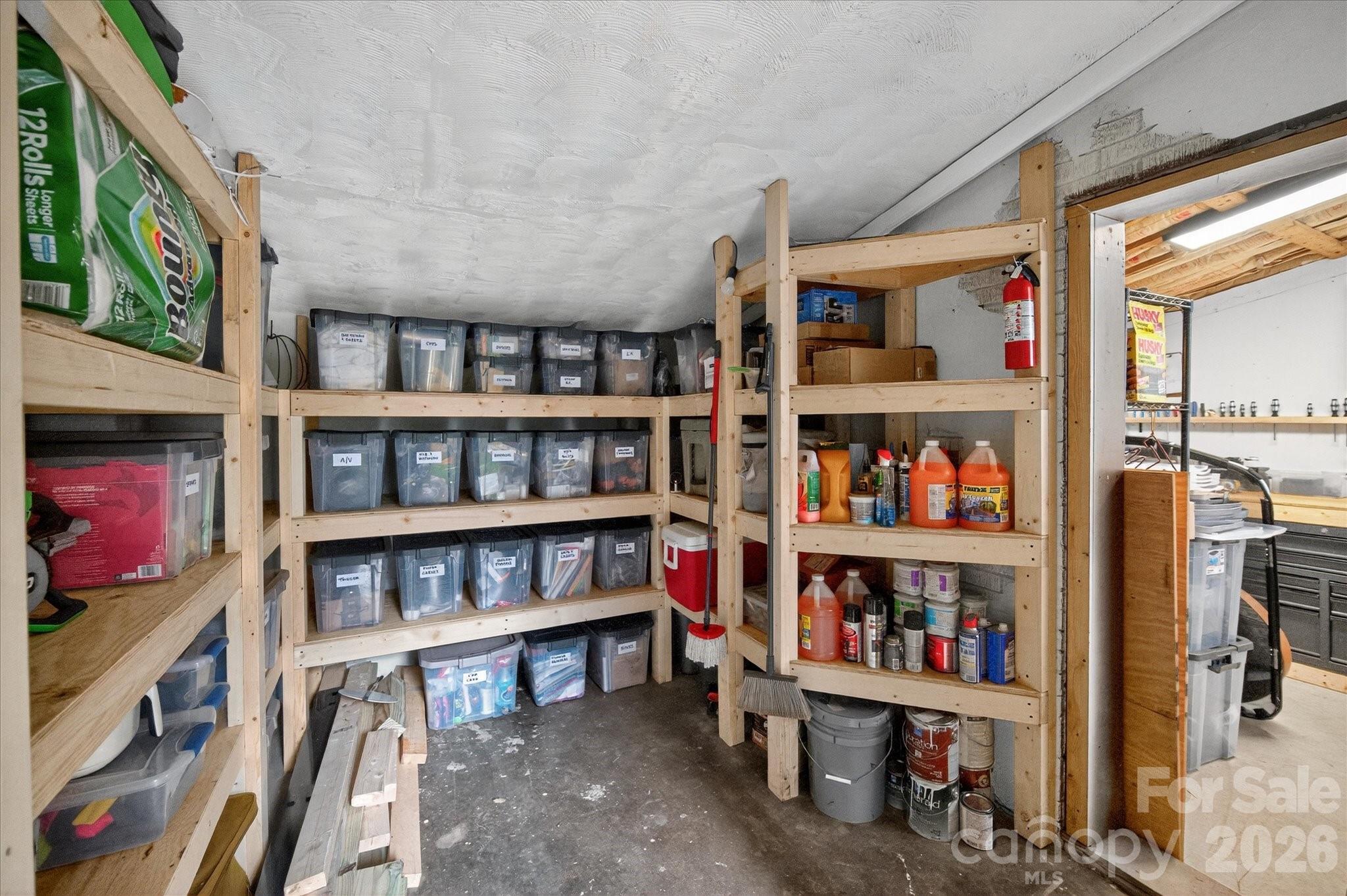 6431 Rosecrest Drive Charlotte, NC 28210 - Photo 37 of 46 a living room with lots of books
