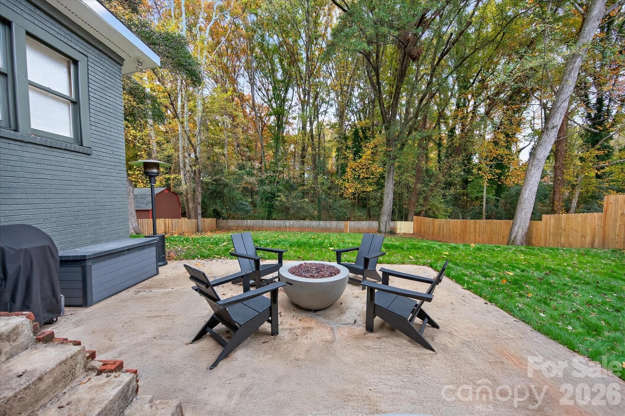 6431 Rosecrest Drive Charlotte, NC 28210 - Photo 39 of 46 a view of a patio with a chairs and table in the patio