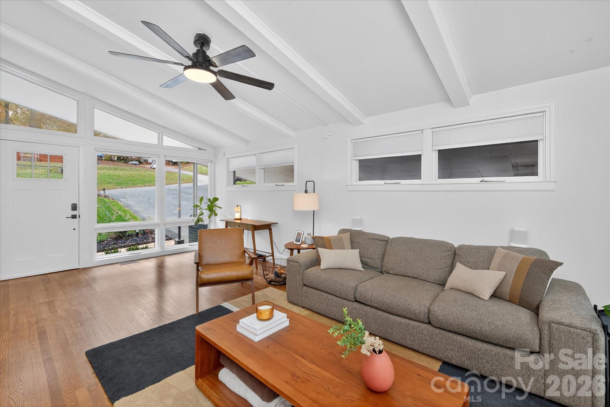 6431 Rosecrest Drive Charlotte, NC 28210 - Photo 8 of 46 a living room with furniture a ceiling fan and a large window