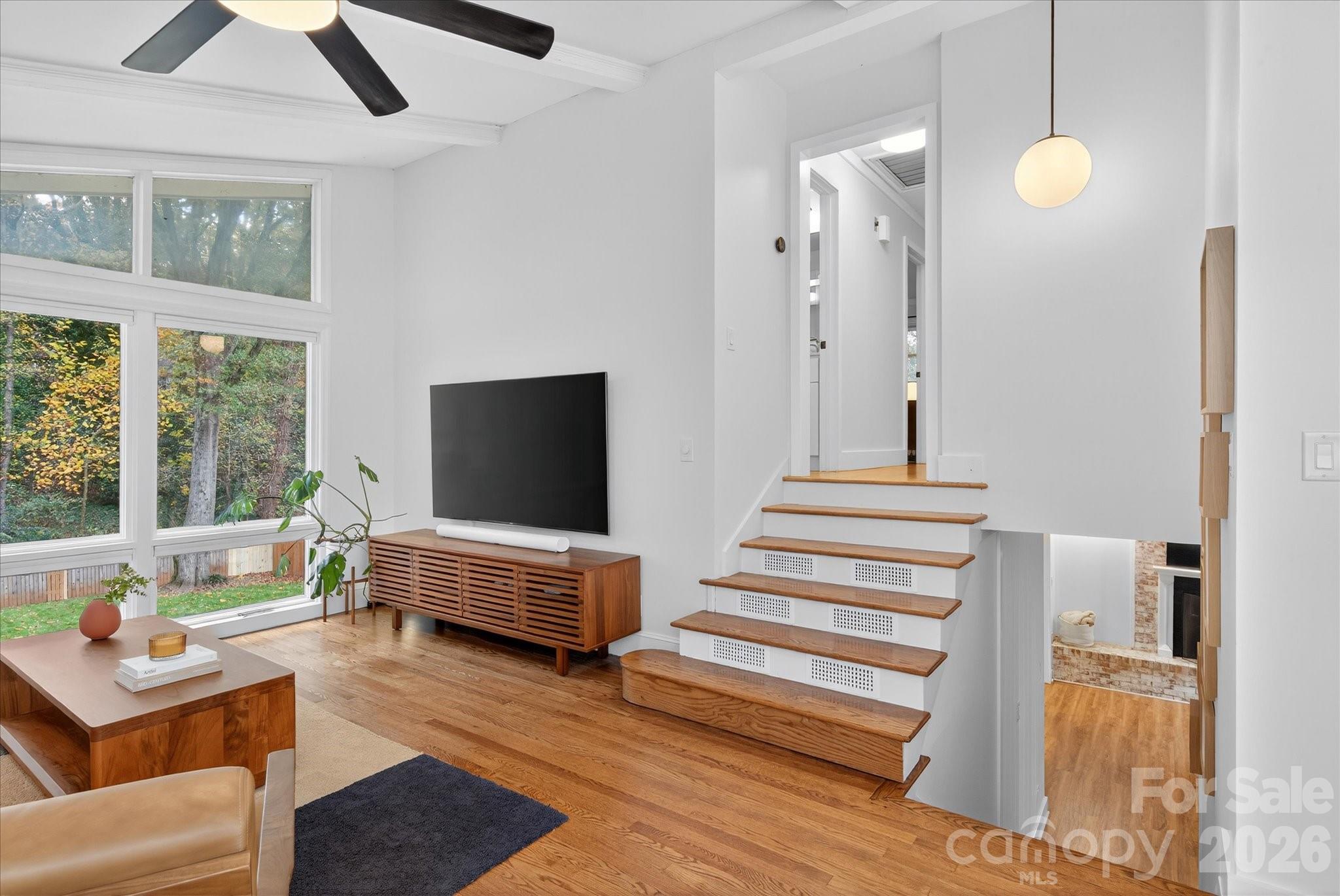 6431 Rosecrest Drive Charlotte, NC 28210 - Photo 10 of 46 a living room with furniture and wooden floor