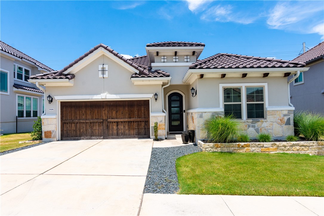 a view of house with yard and entertaining space