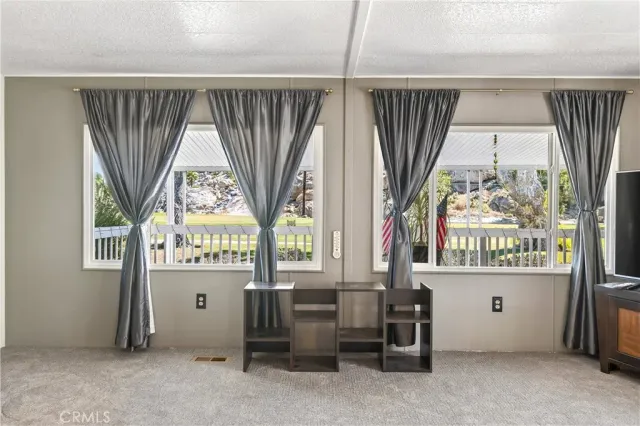 a room with window and furniture