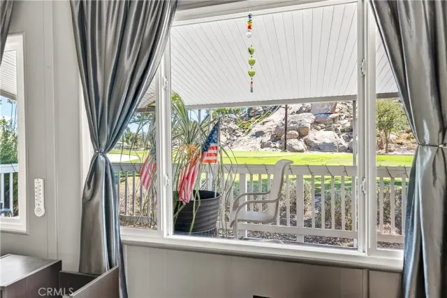 a view of a room with a large window