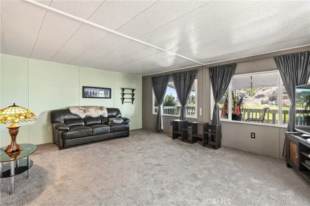 a living room with furniture and windows