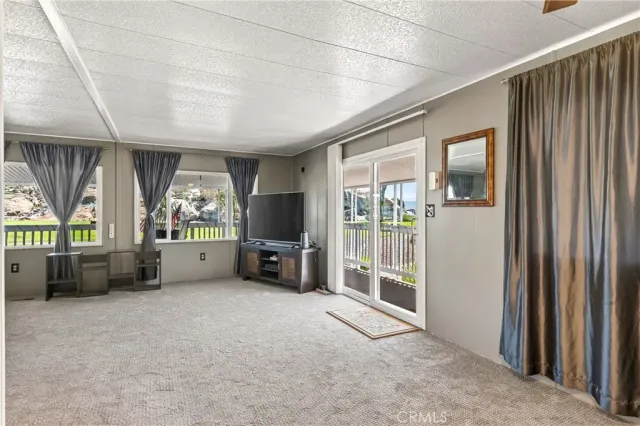 a view of livingroom with furniture and a window