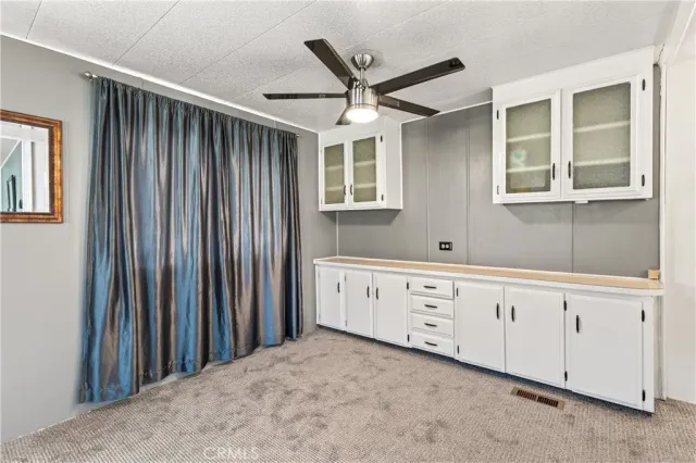 a view of a hallway with windows