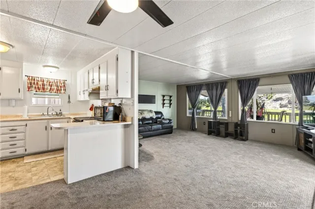 a kitchen with sink cabinets and window