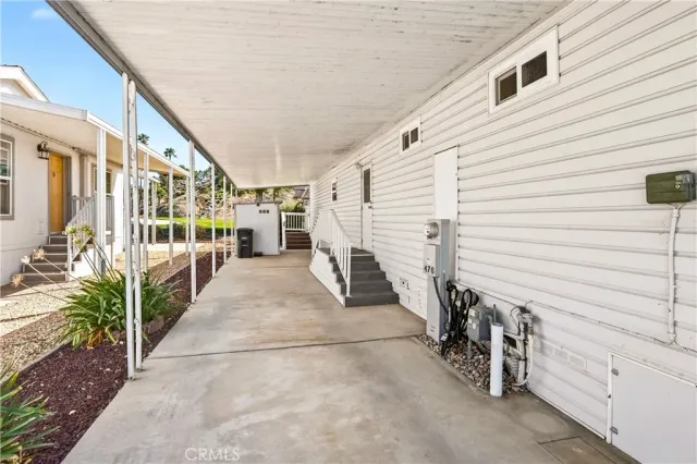 a view of a porch with seating space