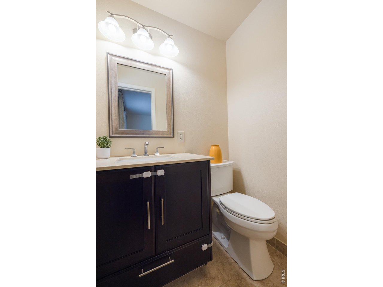 3320 23rd Street Boulder, CO 80304 - Photo 13 of 25 Main-level half-bath bath with window-simple, bright, and functional.