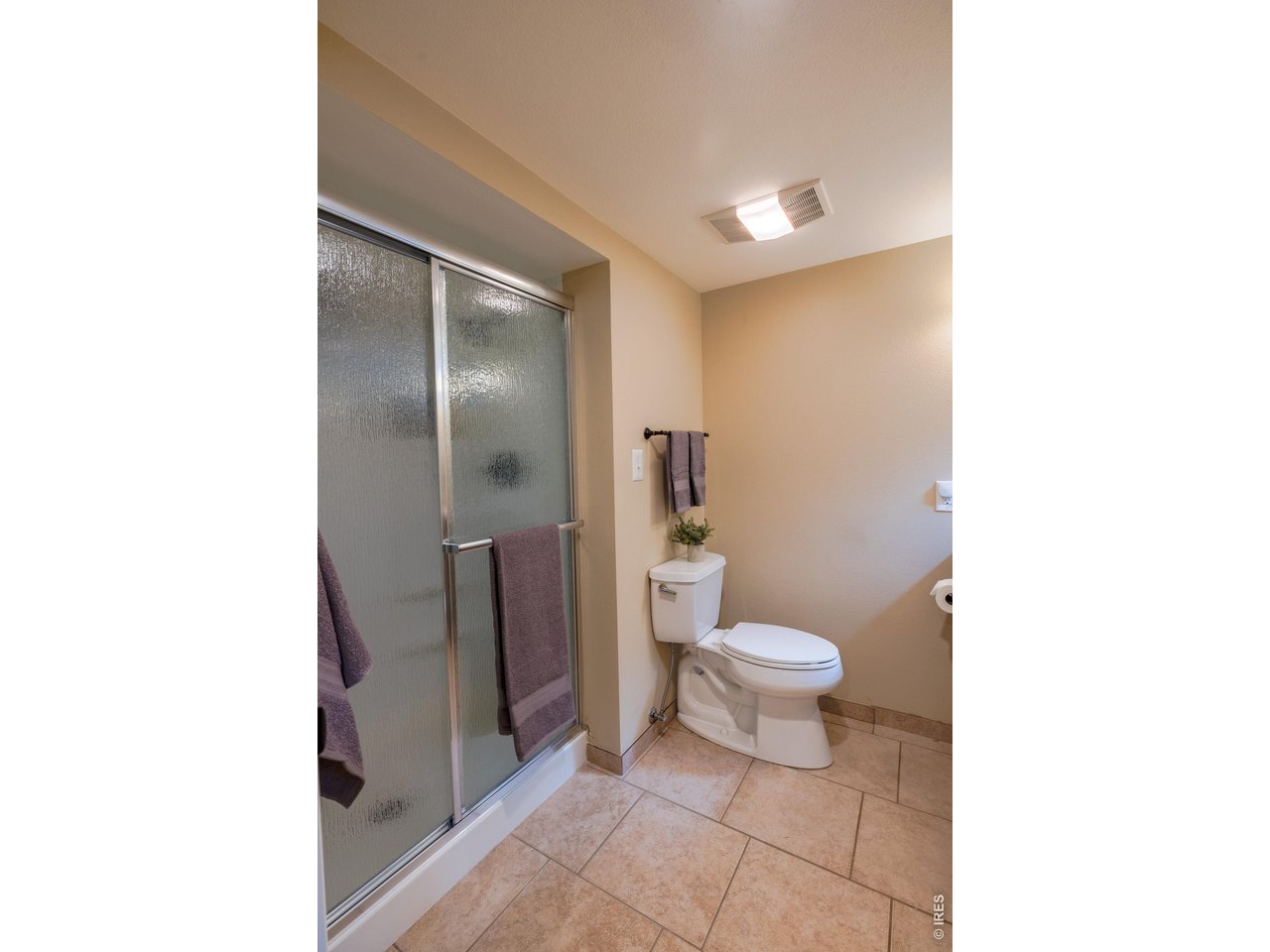 3320 23rd Street Boulder, CO 80304 - Photo 16 of 25 Renovated three-quarter bath (2014) with a large shower and ample vanity space for everyday ease.