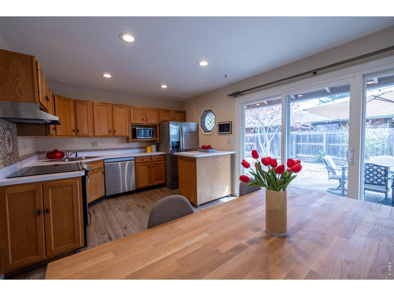 3320 23rd Street Boulder, CO 80304 - Photo 5 of 25 A warm, functional kitchen with thoughtful updates, featuring an octagonal window that brings in soft, protected fresh air and a layout designed for easy everyday living.