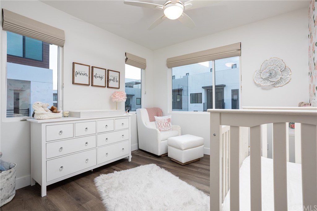 82 Ballast Point Tustin, CA 92782 - Photo 13 of 30 a bedroom with furniture and a large window