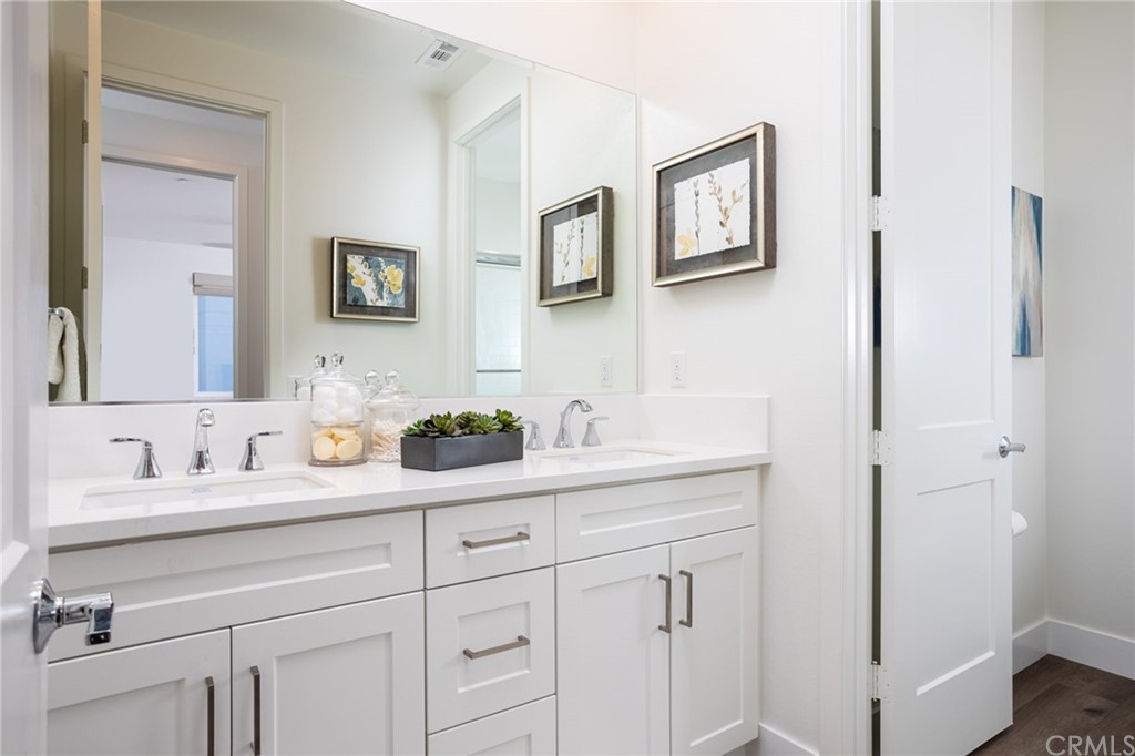 82 Ballast Point Tustin, CA 92782 - Photo 14 of 30 a bathroom with a sink and a mirror