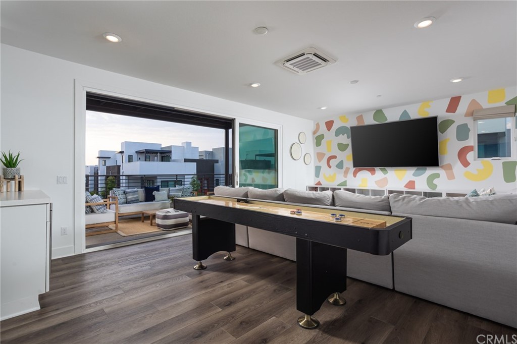 82 Ballast Point Tustin, CA 92782 - Photo 16 of 30 a living room with furniture and a flat screen tv